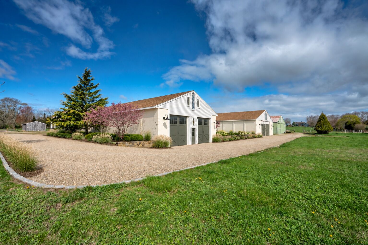 Rendering of the barn arrival with a defined gravel apron, refreshed doors and native planting