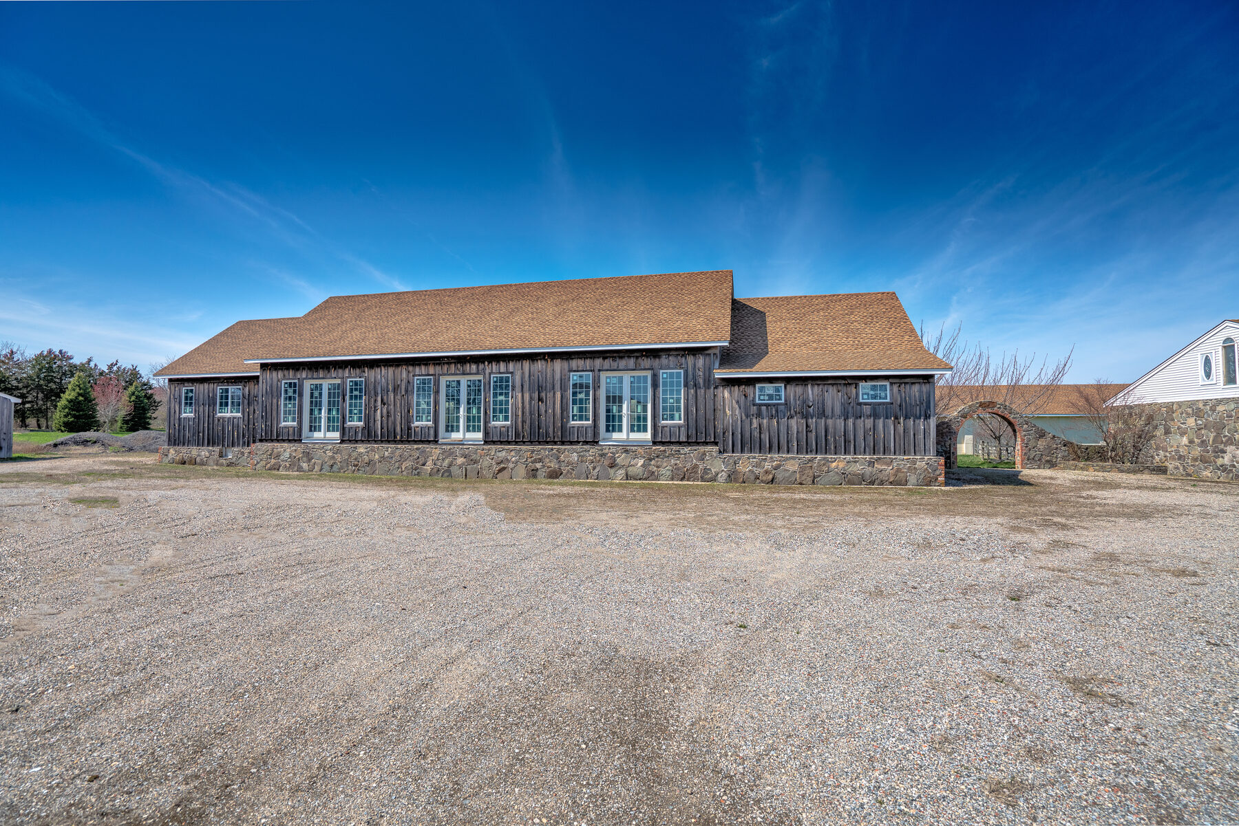 Front exterior of the multi-use barn with stone foundation