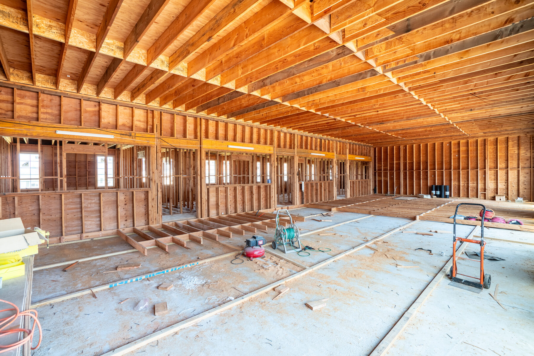 Multi-use barn interior, wide view of framed-out residential layout