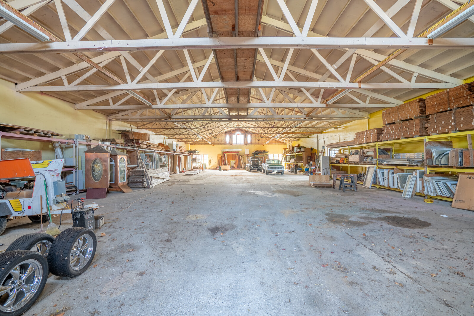 Interior of the former indoor riding arena, 30-foot cathedral ceilings